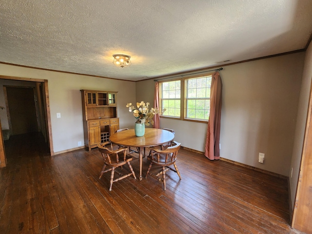 dining space featuring dark wood-style floors, crown molding, a textured ceiling, and baseboards