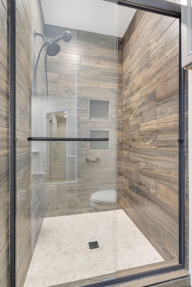1970 Pointe Royale Dr, Branson, MO 65616 - bathroom featuring a stall shower and toilet