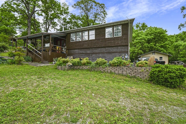 view of front of property with a front yard and stairs