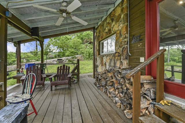 wooden deck featuring a ceiling fan