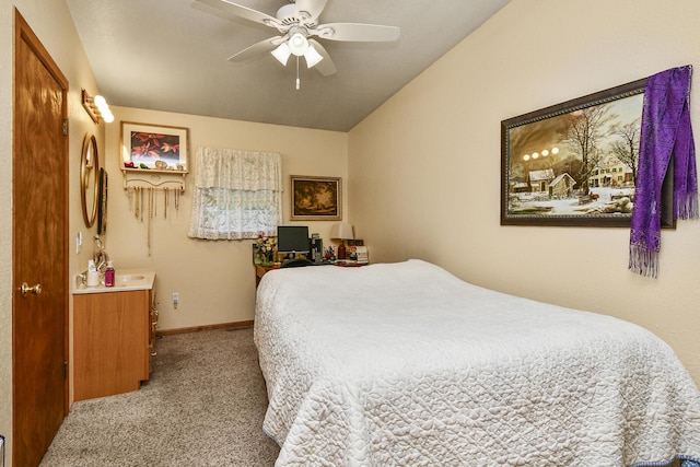 bedroom featuring carpet, baseboards, vaulted ceiling, and ceiling fan