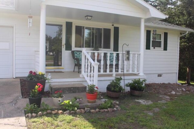 23197 Oakwood Cir, Hermitage, MO 65668 - entrance to property with covered porch and crawl space