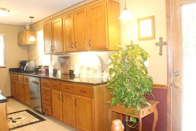 23197 Oakwood Cir, Hermitage, MO 65668 - kitchen featuring stainless steel dishwasher, dark countertops, hanging light fixtures, and brown cabinets