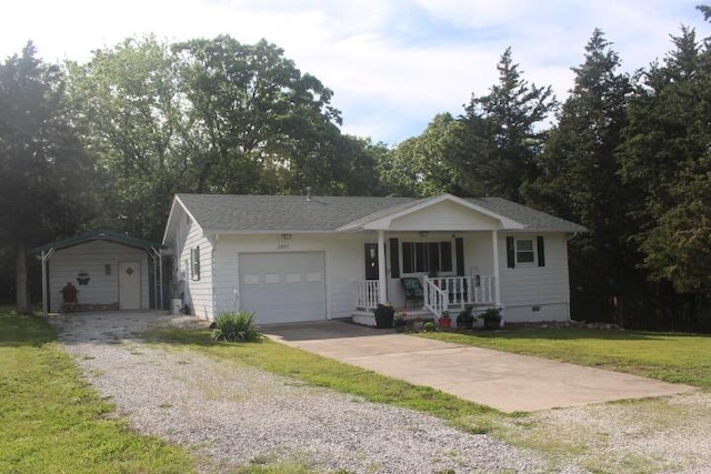 23197 Oakwood Cir, Hermitage, MO 65668 - single story home featuring covered porch, a front yard, crawl space, gravel driveway, and an attached garage