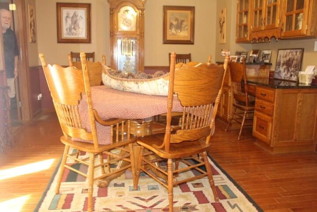23197 Oakwood Cir, Hermitage, MO 65668 - dining space featuring wood finished floors and a wainscoted wall