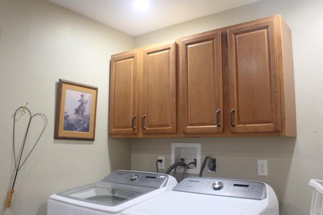 23197 Oakwood Cir, Hermitage, MO 65668 - laundry area featuring cabinet space and washer and clothes dryer
