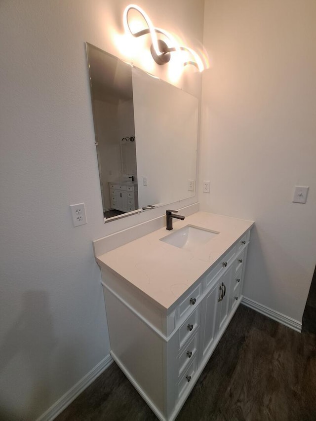 137 Vista Ln, Granby, MO 64844 - bathroom with baseboards, vanity, and wood finished floors