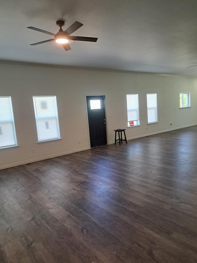 137 Vista Ln, Granby, MO 64844 - unfurnished living room featuring a ceiling fan, dark wood-style flooring, and baseboards