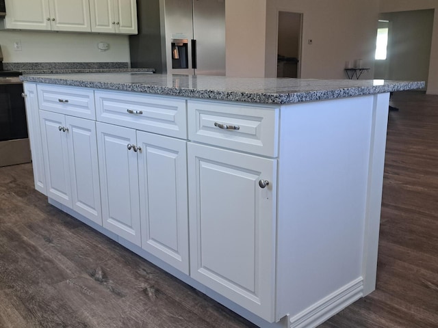 137 Vista Ln, Granby, MO 64844 - kitchen featuring stainless steel appliances, dark wood finished floors, a center island, and white cabinetry