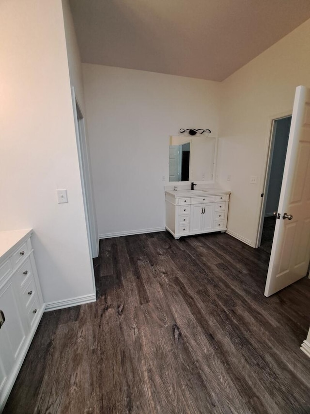 137 Vista Ln, Granby, MO 64844 - unfurnished bedroom with dark wood-type flooring and baseboards