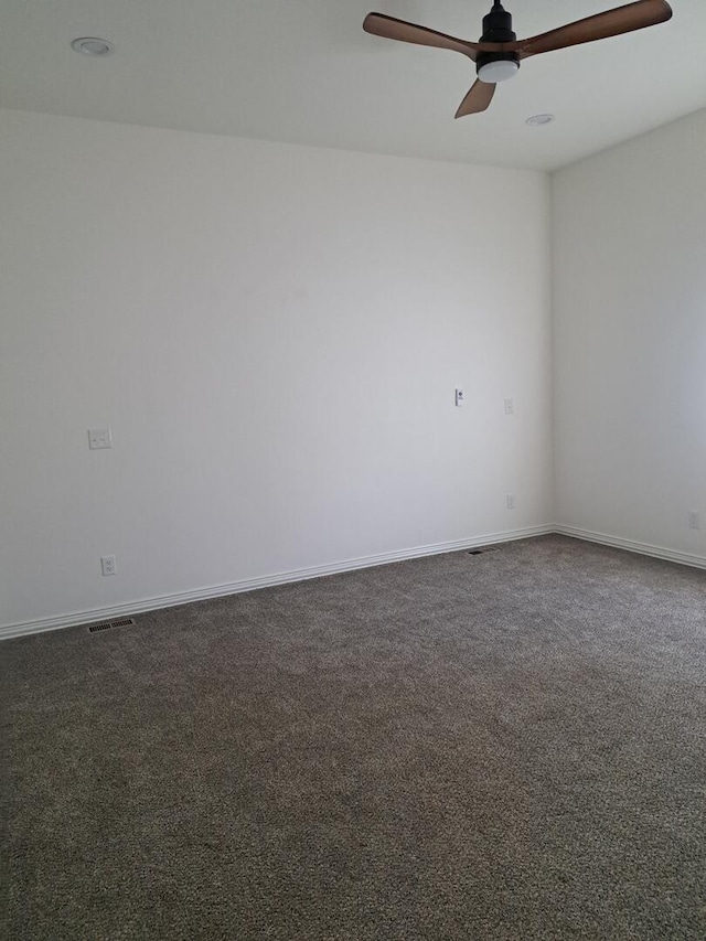 137 Vista Ln, Granby, MO 64844 - unfurnished room featuring dark carpet, a ceiling fan, and baseboards