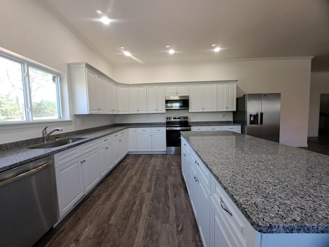 137 Vista Ln, Granby, MO 64844 - kitchen with stainless steel appliances, a sink, dark wood-type flooring, white cabinets, and dark stone countertops
