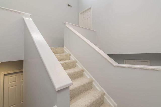 stairway featuring baseboards