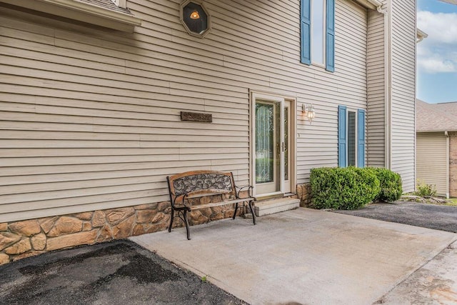 doorway to property featuring a patio