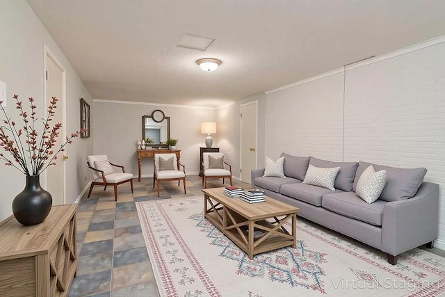 living area featuring a textured ceiling and baseboards