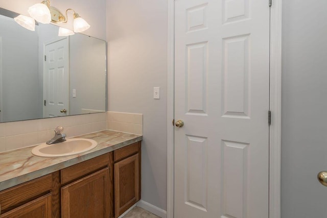 bathroom featuring backsplash and vanity