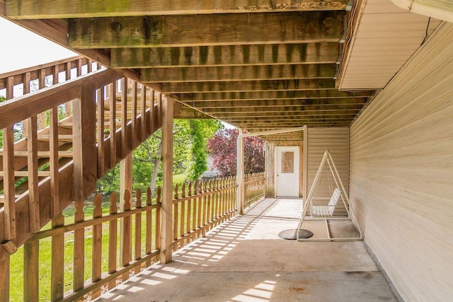view of patio / terrace with stairway and fence