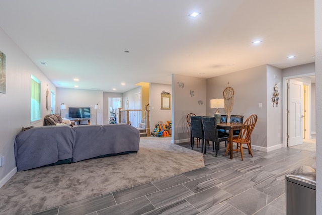 living room with baseboards and recessed lighting