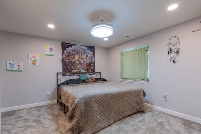 carpeted bedroom featuring baseboards and recessed lighting
