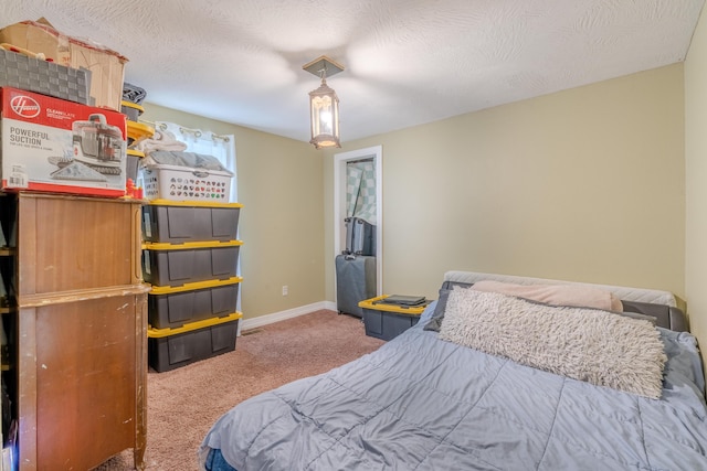 bedroom featuring carpet and baseboards