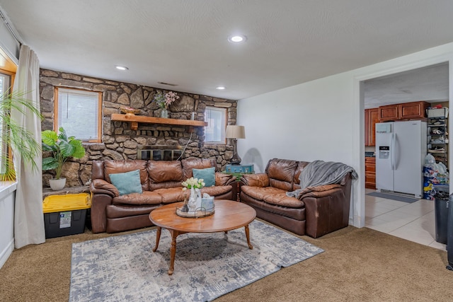 living area with light carpet, a fireplace, and recessed lighting