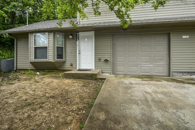 1292 Hillcrest Pl Unit A & B, Branson, MO 65616 - view of front facade featuring a garage, concrete driveway, and a shingled roof