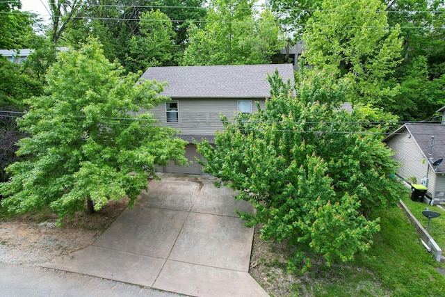 1292 Hillcrest Pl Unit A & B, Branson, MO 65616 - view of home's exterior with concrete driveway and roof with shingles