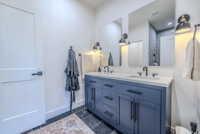 139 Cherokee Dr, Kimberling City, MO 65686 - bathroom with tile patterned floors, double vanity, baseboards, and a shower