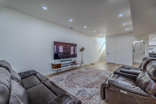 139 Cherokee Dr, Kimberling City, MO 65686 - living area featuring stairway, wood finished floors, recessed lighting, and baseboards