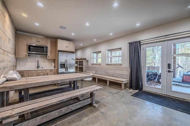 139 Cherokee Dr, Kimberling City, MO 65686 - kitchen featuring appliances with stainless steel finishes, light brown cabinets, concrete flooring, french doors, and recessed lighting