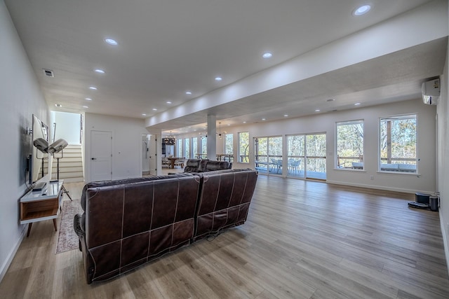 139 Cherokee Dr, Kimberling City, MO 65686 - living room featuring light wood-style floors, a wall mounted AC, recessed lighting, and baseboards