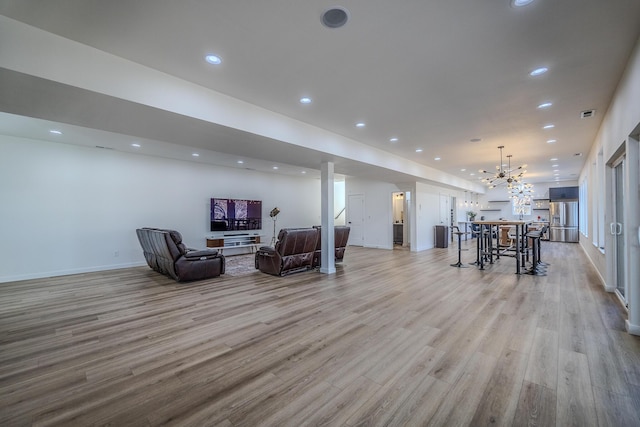 139 Cherokee Dr, Kimberling City, MO 65686 - living area with light wood-type flooring, a chandelier, baseboards, and recessed lighting