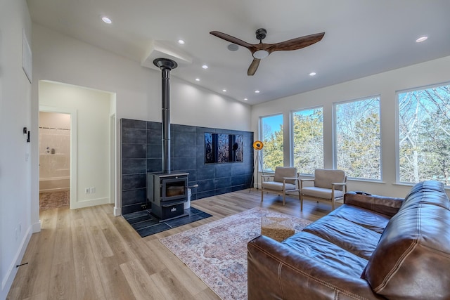 139 Cherokee Dr, Kimberling City, MO 65686 - living room with a ceiling fan, a wood stove, healthy amount of natural light, wood finished floors, and recessed lighting