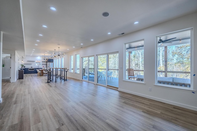 139 Cherokee Dr, Kimberling City, MO 65686 - living area with light wood-style flooring, a chandelier, recessed lighting, baseboards, and a ceiling fan