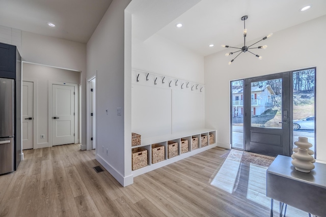 139 Cherokee Dr, Kimberling City, MO 65686 - mudroom featuring light wood-style flooring, a towering ceiling, a chandelier, baseboards, and recessed lighting
