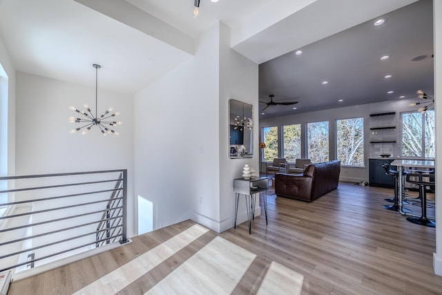 139 Cherokee Dr, Kimberling City, MO 65686 - living room featuring a chandelier, healthy amount of natural light, wood finished floors, recessed lighting, and baseboards
