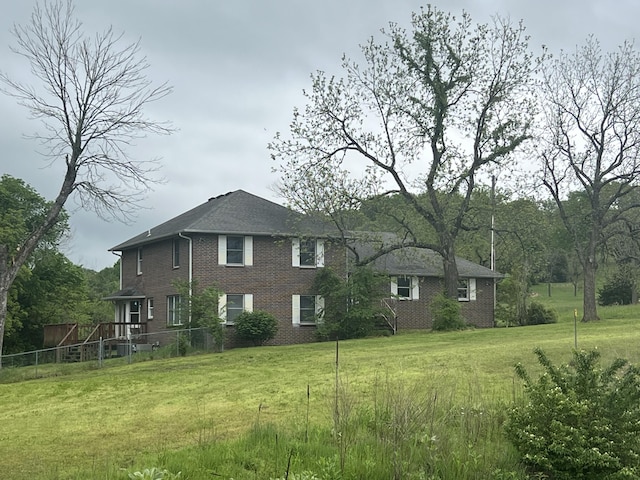 9556 N State Highway H, Pleasant Hope, MO 65725 - view of property exterior with brick siding and a yard