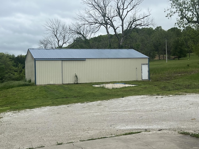 9556 N State Highway H, Pleasant Hope, MO 65725 - view of pole building featuring a lawn and a view of trees