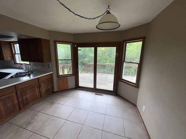 9556 N State Highway H, Pleasant Hope, MO 65725 - kitchen with a sink, light countertops, and light tile patterned floors