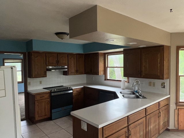9556 N State Highway H, Pleasant Hope, MO 65725 - kitchen featuring electric range oven, a sink, freestanding refrigerator, under cabinet range hood, and light tile patterned floors