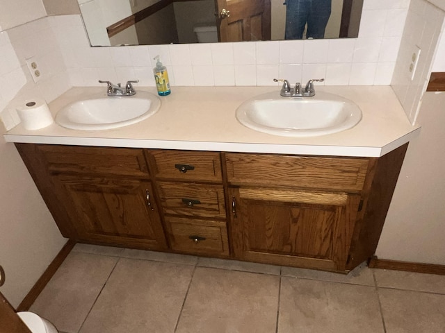 9556 N State Highway H, Pleasant Hope, MO 65725 - full bath with double vanity, baseboards, backsplash, and tile patterned floors