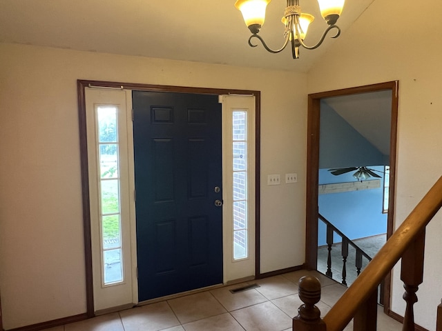 9556 N State Highway H, Pleasant Hope, MO 65725 - entryway featuring a chandelier, vaulted ceiling, baseboards, light tile patterned floors, and stairs