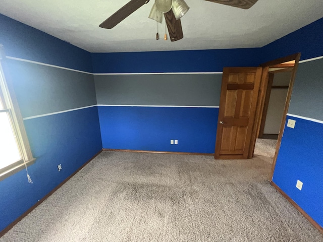 9556 N State Highway H, Pleasant Hope, MO 65725 - unfurnished bedroom with carpet floors, baseboards, and a ceiling fan