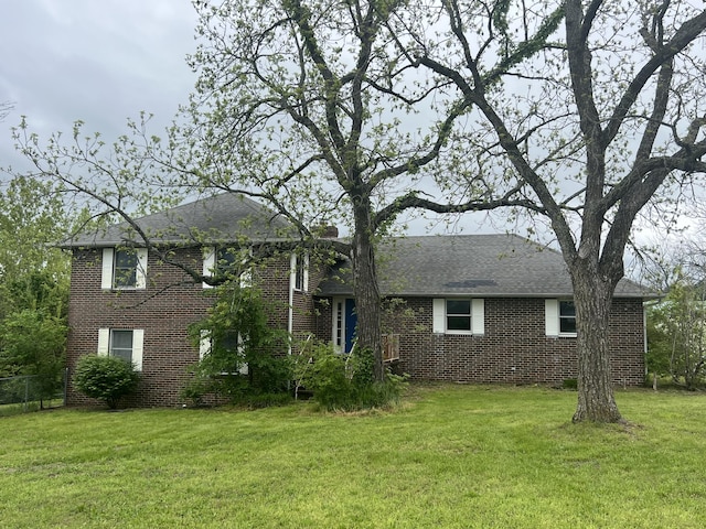 9556 N State Highway H, Pleasant Hope, MO 65725 - view of front facade with brick siding, a front yard, and roof with shingles