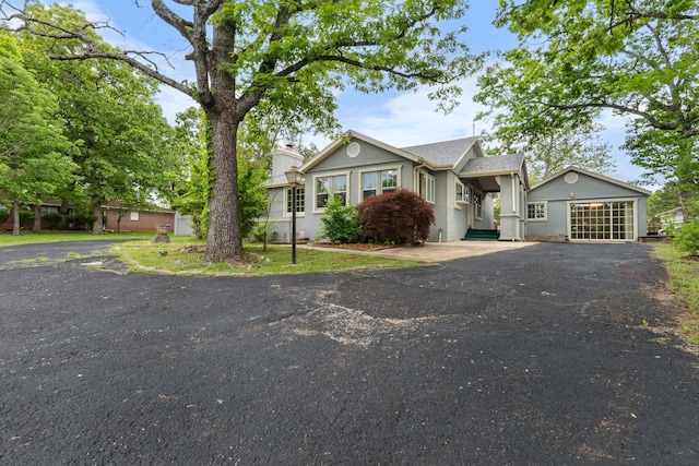 view of front of home with driveway and stucco siding