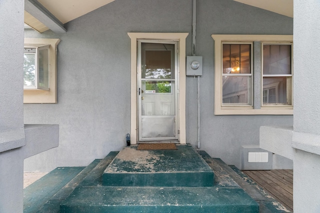 doorway to property with stucco siding