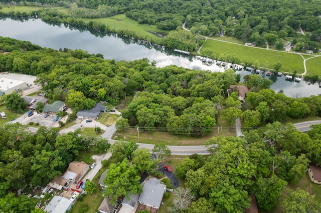 aerial view of a nearby body of water and a forest