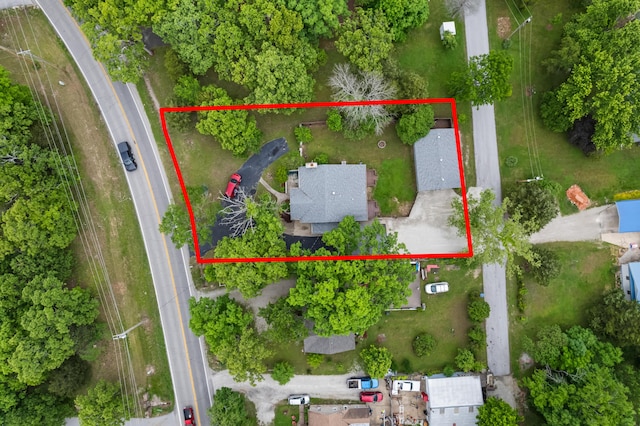 aerial view of property and surrounding area with property parcel outlined