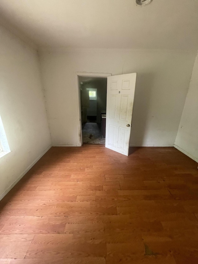 421 N Phelps St, Mansfield, MO 65704 - spare room featuring wood finished floors and baseboards