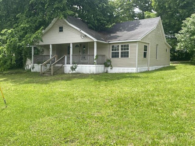 421 N Phelps St, Mansfield, MO 65704 - view of front facade featuring a porch and a front lawn